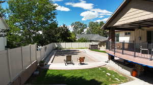 Exterior space featuring ceiling fan and a patio area