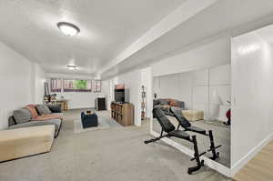 Exercise room featuring light colored carpet