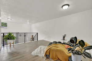 Loft featuring natural light and a view