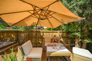 Wooden deck featuring an outdoor living space