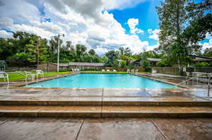 View of pool featuring an outbuilding