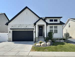 Modern farmhouse style home with a garage