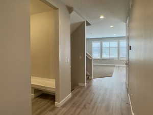 Hallway featuring light wood-type flooring