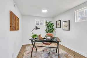 Bedroom 4 or Office with  wood-style flooring and a wealth of natural light