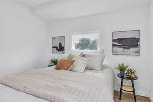 Bedroom 1 with wood-style flooring