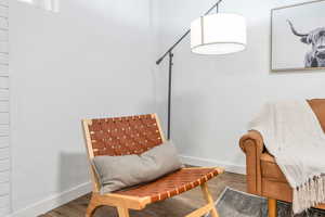 Basement family room details featuring hardwood / wood-style flooring