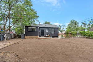 View of rear view of property and huge backyard as a blank slate for new owner to create their dream backyard