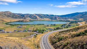 View of mountain feature featuring a rural view and a water view