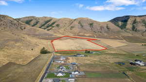 Birds eye view of property with a mountain view