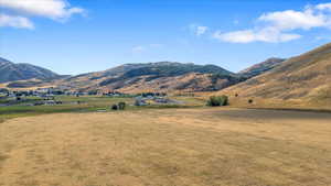 Property view of mountains with a rural view