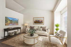 Carpeted living room featuring vaulted ceiling. Virtually Staged