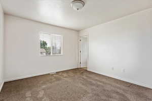 Empty room with carpet flooring