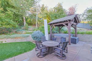 View of patio / terrace with a gazebo and a hot tub