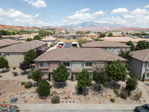 Drone / aerial view of property featuring a mountain view in background