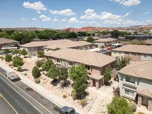 Drone / aerial view  of townhomes featuring a mountain view in background