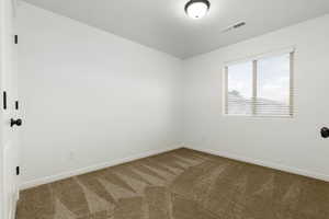 Unfurnished bedroom 3 featuring carpet and white painted walls