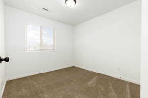 View of carpeted bedroom 2 with white painted walls