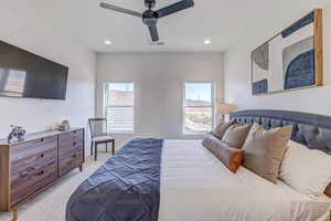 Carpeted bedroom with ceiling fan