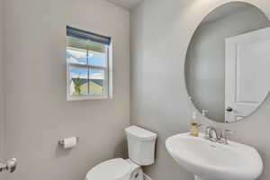 Bathroom featuring sink and toilet