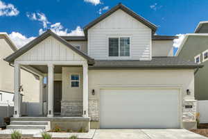 View of front facade featuring a garage