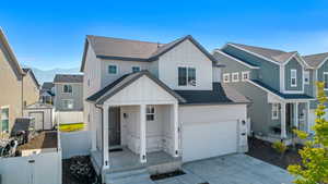 View of front of home featuring a shed