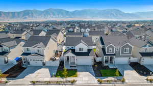 Birds eye view of property with a mountain view