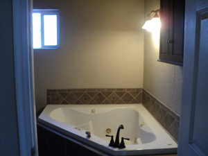 Bathroom with tiled bath