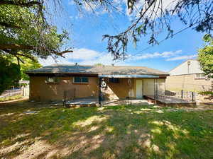 Rear of home.  Deck.  Covered patio.