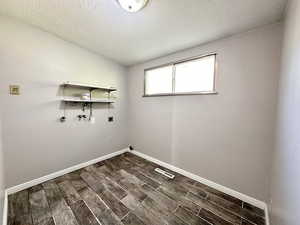 Laundry room.  Tile flooring.  Window.