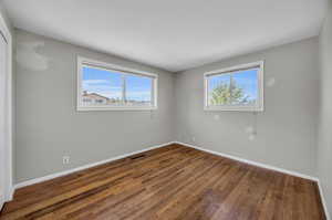 Unfurnished room featuring wood-type flooring