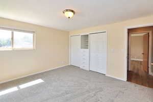 Main Floor Bedroom with Built-Ins and Double Closets (NEW Carpet)