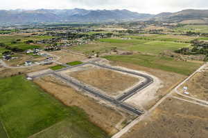 Drone / aerial view featuring a mountain view and a rural view