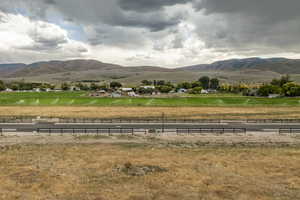 View of property's community featuring a mountain view and a rural view