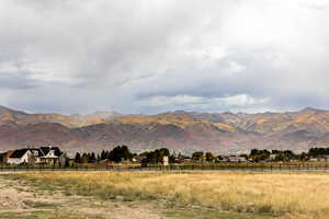 Property view of mountains with a rural view