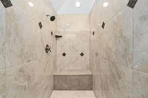 Bathroom featuring a tile shower