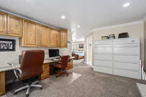 Office featuring ornamental molding and light carpet