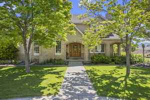 View of front of property with a front yard