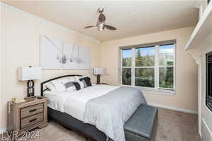 Bedroom featuring ceiling fan and light carpet