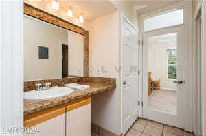 Bathroom featuring vanity and tile patterned floors