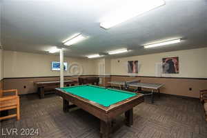 Game room with carpet flooring and billiards