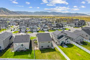 Birds eye view of property with a mountain view