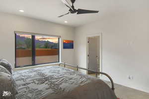 Carpeted bedroom with ceiling fan