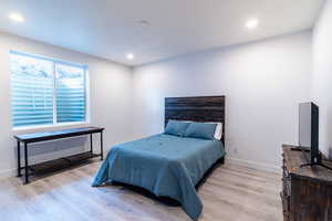 Bedroom featuring light wood-type flooring