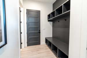 Mudroom with light wood-type flooring