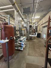 Basement featuring water heater