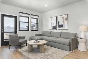 Living room with light hardwood / wood-style flooring