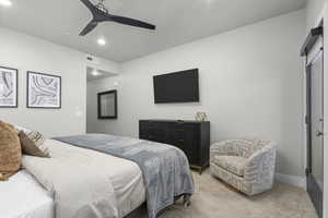 Bedroom featuring ceiling fan and light colored carpet