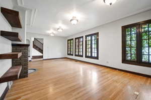 Unfurnished living room with light wood-type flooring