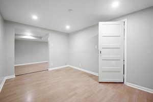 Unfurnished room featuring light wood-type flooring