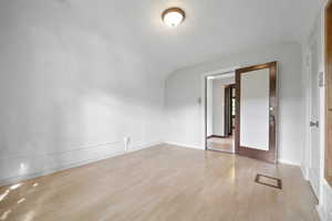 Spare room featuring light hardwood / wood-style flooring and french doors